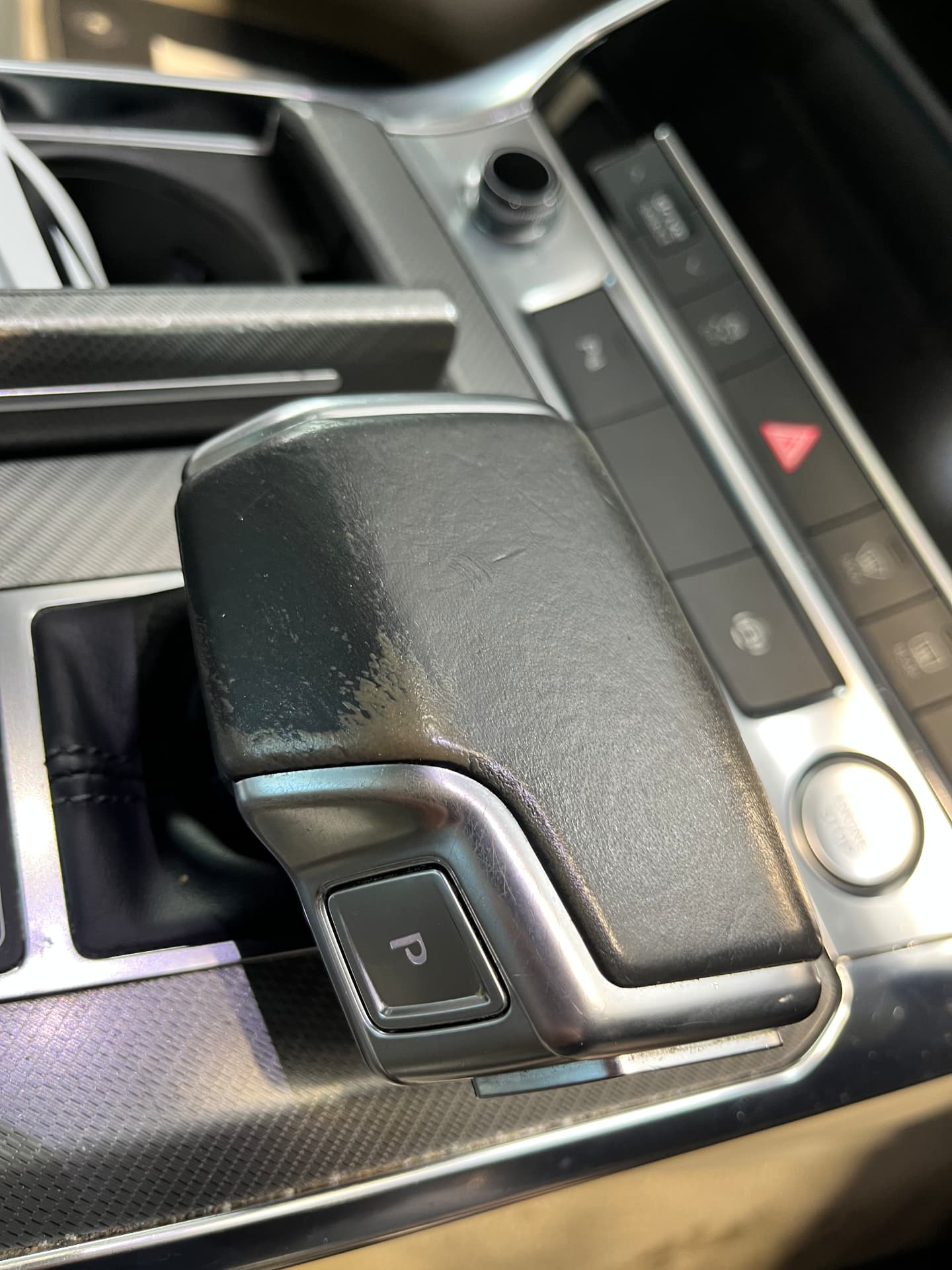 Worn black leather automatic gear selector before restoration by PJ Leather Paint