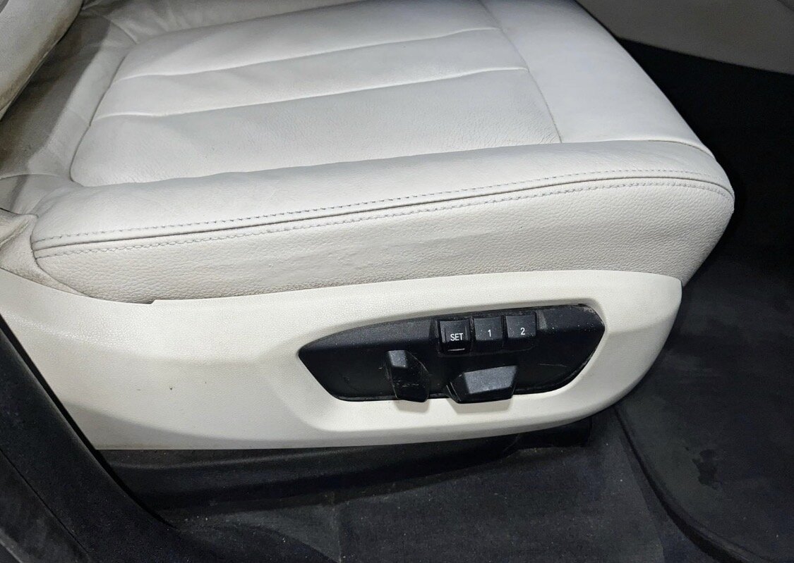The same cream leather seat cushion and side bolster after repair and refinishing by PJ Leather Paint