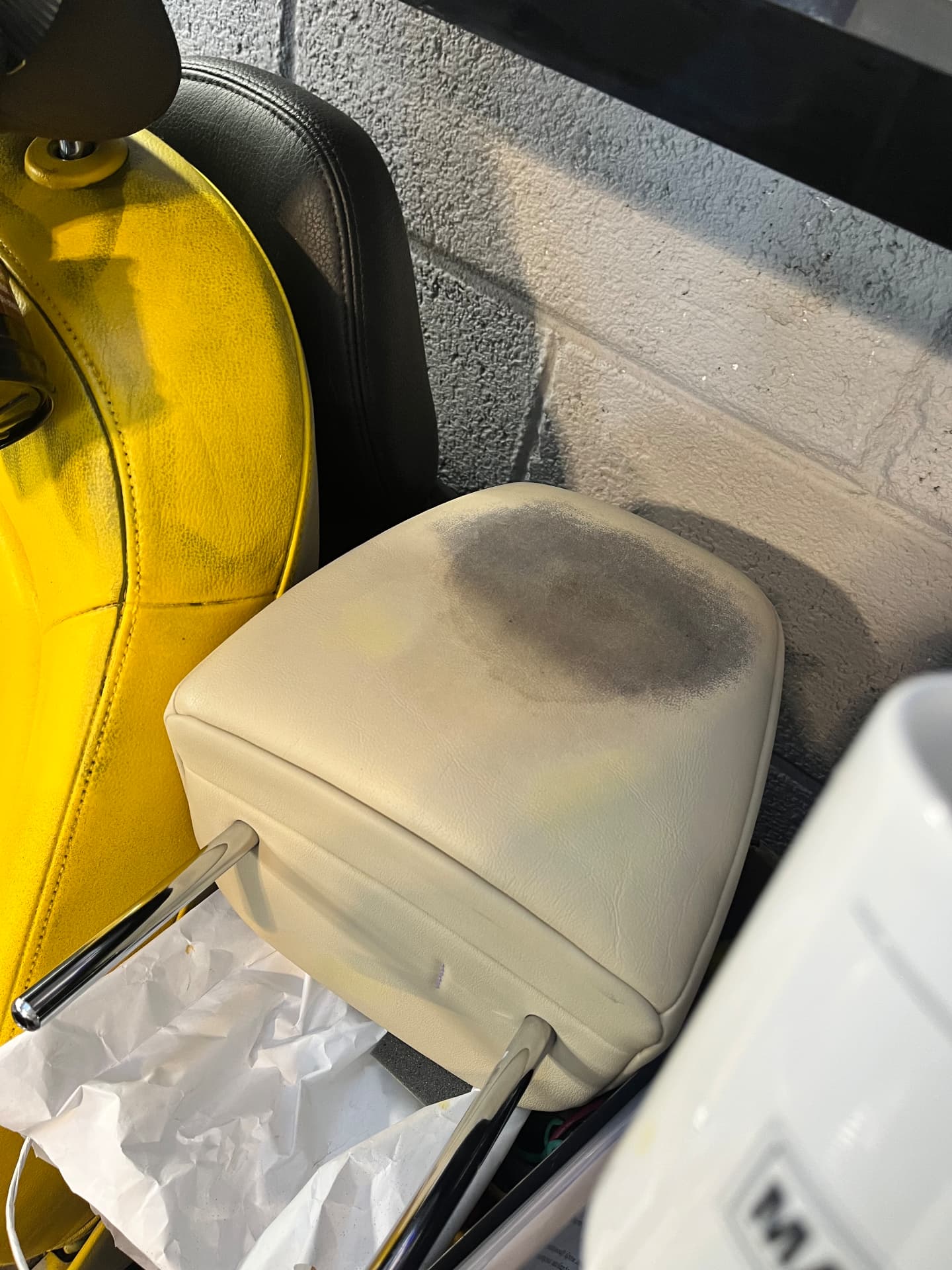 Marked cream leather armrest before restoration by PJ Leather Paint