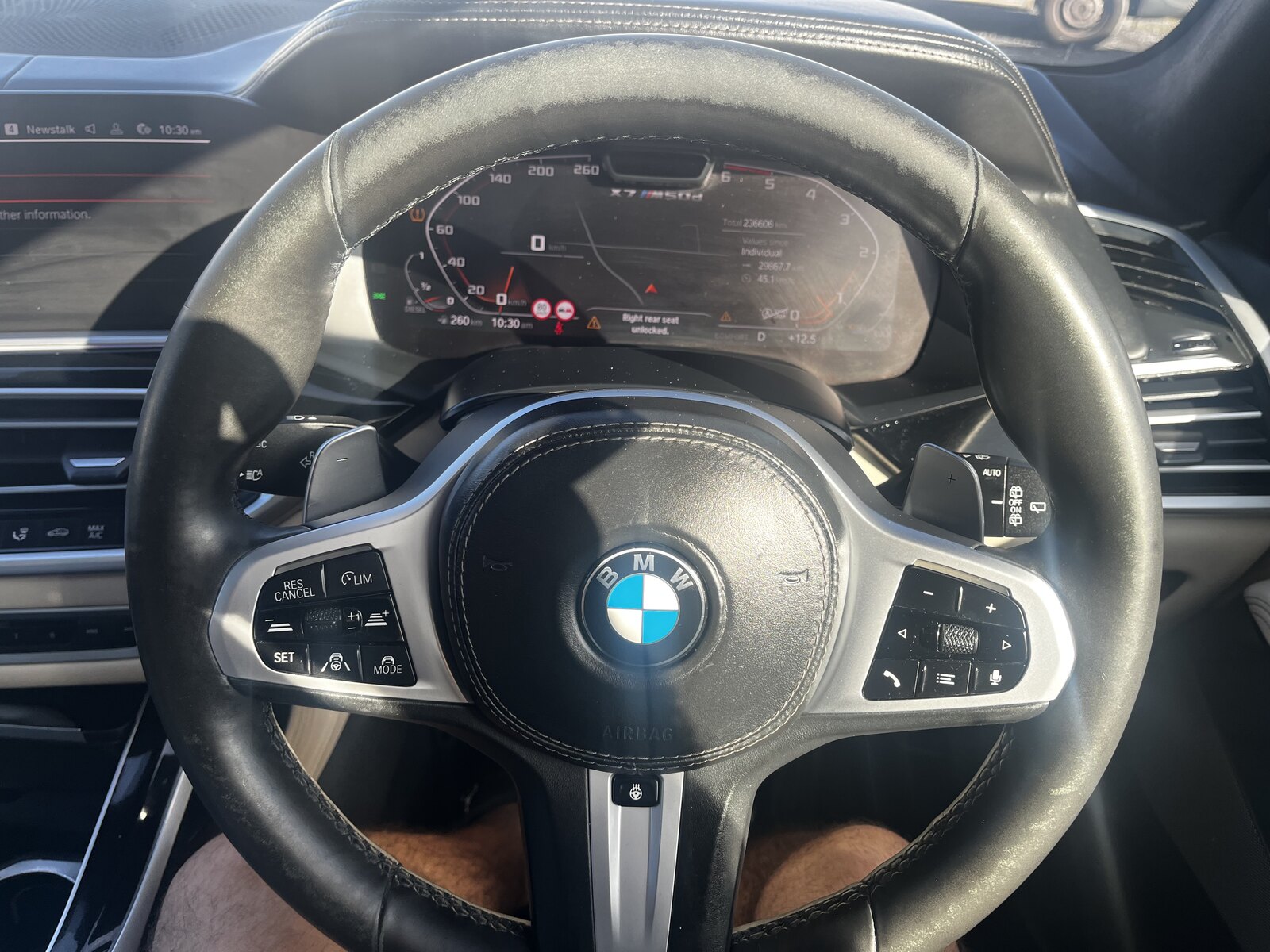 Worn top rim of a BMW M Sport leather steering wheel before restoration by PJ Leather Paint