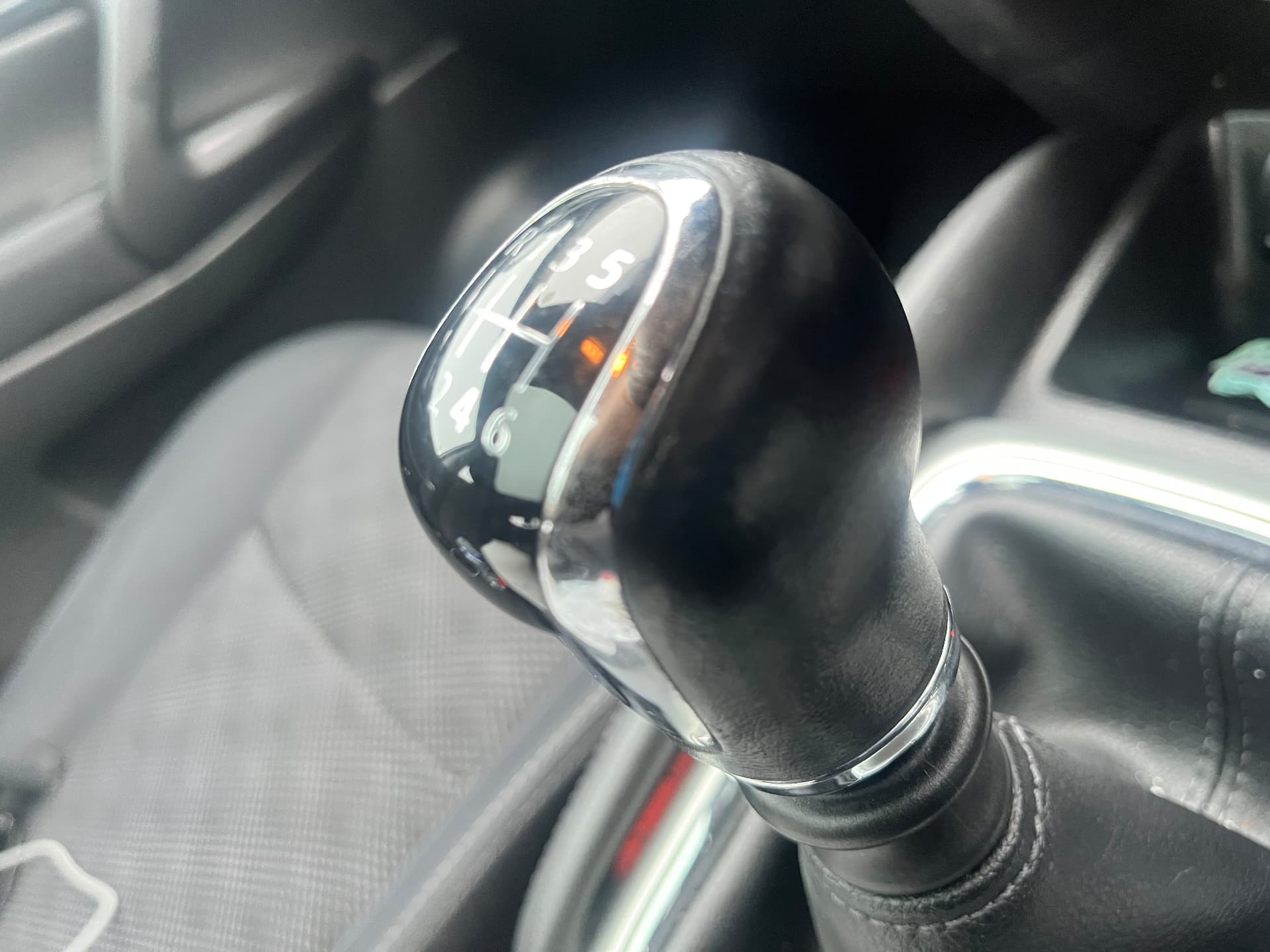 The same black leather manual gear knob after refinishing by PJ Leather Paint