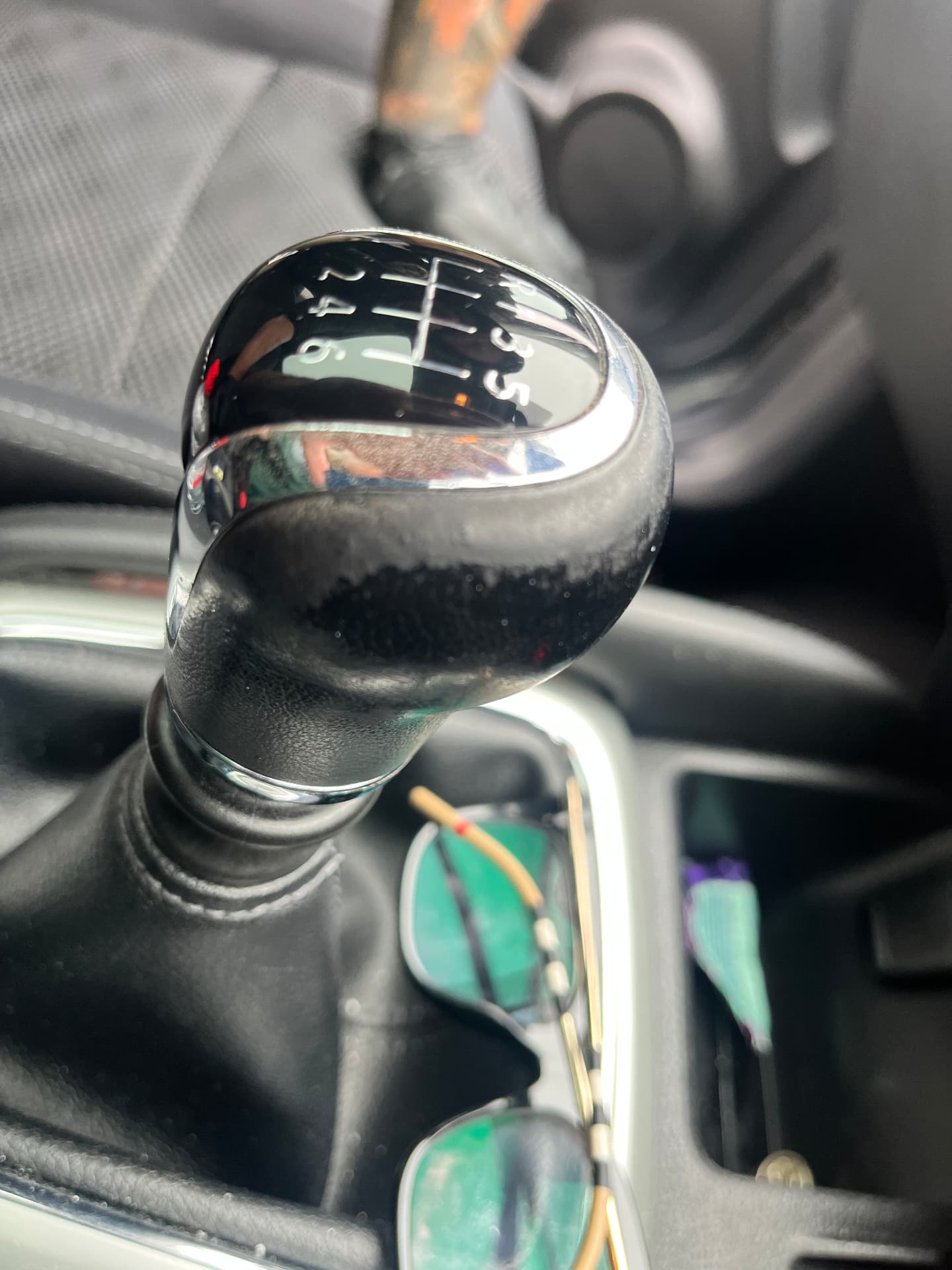 Worn black leather manual gear knob before restoration by PJ Leather Paint