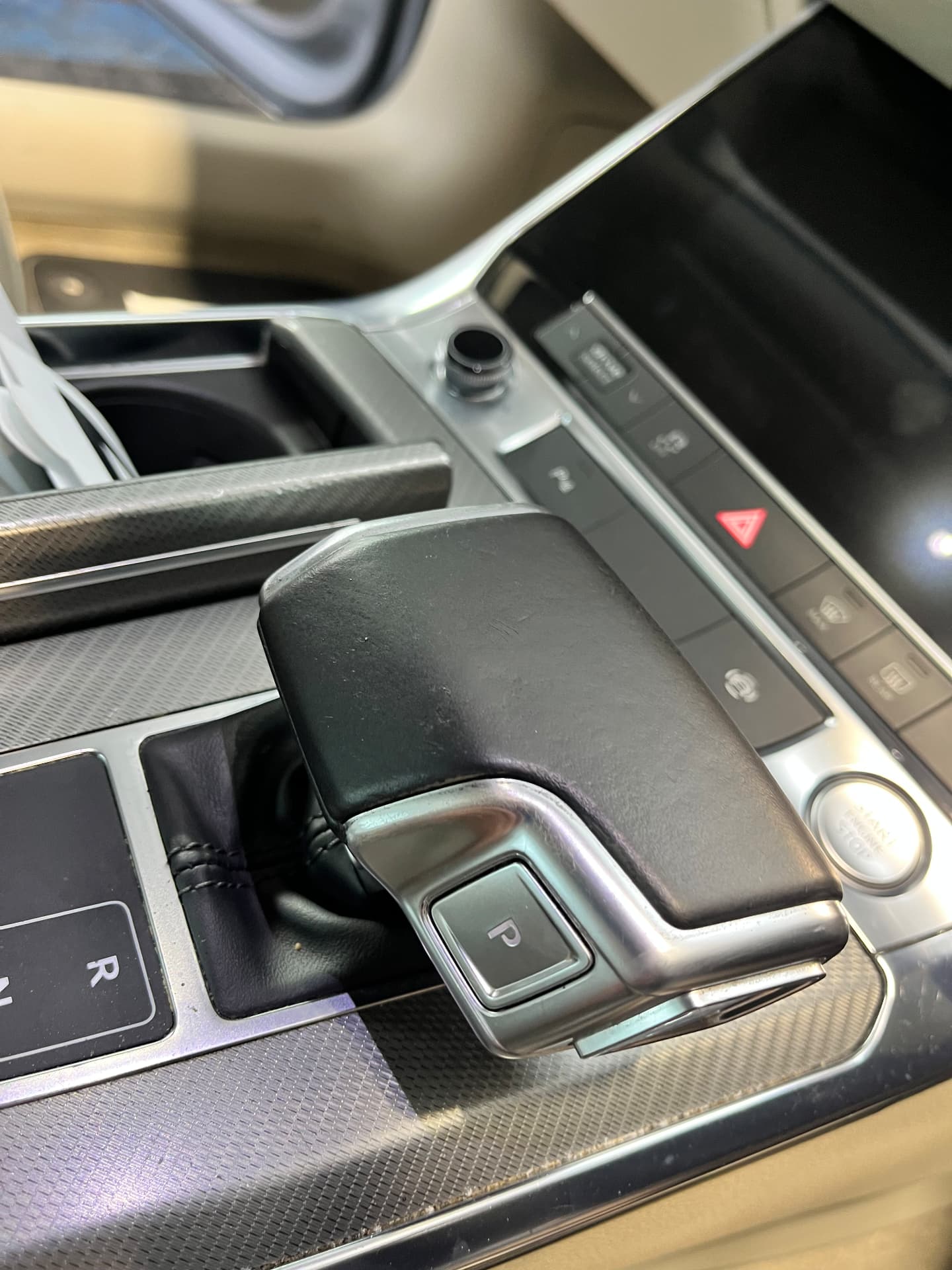 The same black leather automatic gear selector after refinishing by PJ Leather Paint