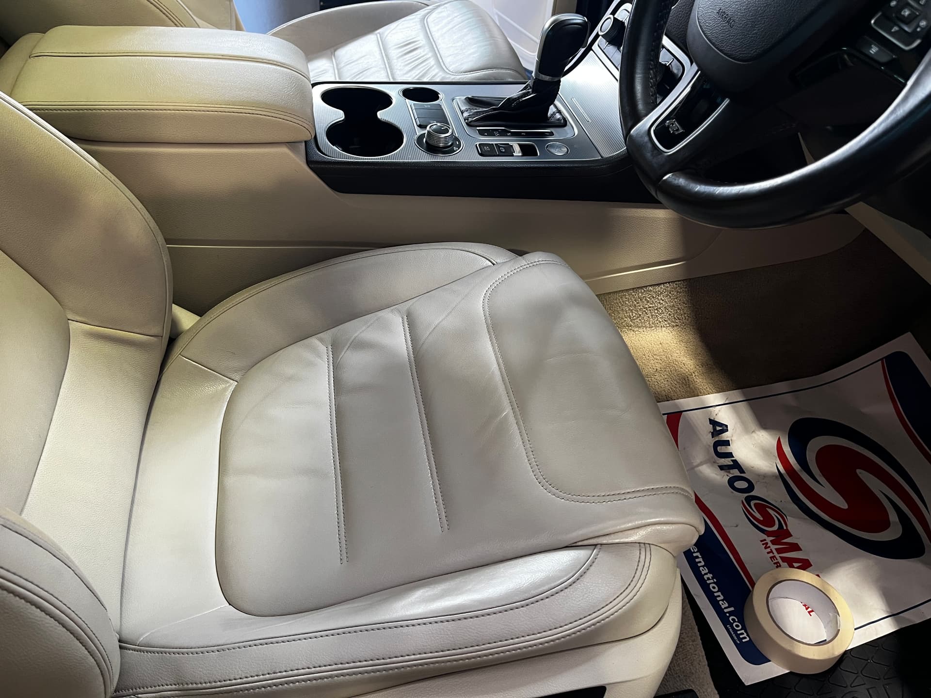 The same cream leather seat cushion after restoration by PJ Leather Paint